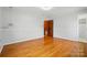 Spacious bedroom features wood floors, neutral walls, and closet space at 3135 Lake Shore S Rd, Denver, NC 28037
