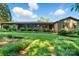 Inviting single-story home with a covered front porch, mature landscaping, and a well-maintained lawn at 3135 Lake Shore S Rd, Denver, NC 28037