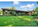 Attractive single-story home featuring a covered porch, lush landscaping, and a spacious well-kept lawn at 3135 Lake Shore S Rd, Denver, NC 28037