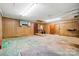 Spacious garage with wood-paneled walls, offering ample storage and workspace for various projects at 3135 Lake Shore S Rd, Denver, NC 28037