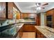 Traditional kitchen features custom wood cabinets, granite countertops, stainless steel appliances, and hardwood floors at 3135 Lake Shore S Rd, Denver, NC 28037