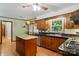 Traditional kitchen features custom wood cabinets, granite countertops, stainless steel appliances and hardwood floors at 3135 Lake Shore S Rd, Denver, NC 28037