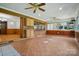 Bright sunroom with tile floors, built-in cabinets, and access to the living room at 3135 Lake Shore S Rd, Denver, NC 28037