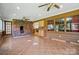 Spacious sunroom with tile floors, brick fireplace, and access to the backyard at 3135 Lake Shore S Rd, Denver, NC 28037