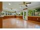 Bright sunroom with tile floors, paneled walls, and large windows at 3135 Lake Shore S Rd, Denver, NC 28037