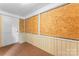Basement with carpet and partial wall paneling, with boarded windows at 317 Campus St, Charlotte, NC 28216