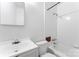 Bathroom featuring tile walls, a sink and mirror, toilet, and bathtub at 317 Campus St, Charlotte, NC 28216