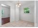 Bright dining area with tiled floors and natural light from window overlooking backyard at 317 Campus St, Charlotte, NC 28216