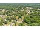 Aerial view of the property surrounded by lush trees in a residential neighborhood at 318 W Peeler St, Salisbury, NC 28146