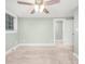 Bright bedroom with neutral carpet, ceiling fan and a window with horizontal blinds at 318 W Peeler St, Salisbury, NC 28146