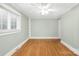 Well-lit bedroom with hardwood floors, white trim, and natural light at 318 W Peeler St, Salisbury, NC 28146