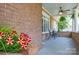 Inviting front porch featuring a ceiling fan and seating area, perfect for relaxation at 318 W Peeler St, Salisbury, NC 28146