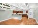 Spacious open kitchen featuring wood cabinets, stainless appliances, and an eat-in breakfast bar at 318 W Peeler St, Salisbury, NC 28146