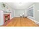 Bright and airy living room with hardwood floors, fireplace, and stylish decor at 318 W Peeler St, Salisbury, NC 28146