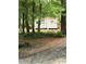 A utility shed is hidden among the trees on this property, adding extra storage for your equipment at 3910 Winter Rd, Rock Hill, SC 29730