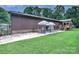 Home featuring a patio with outdoor seating, grassy area and brown exterior at 4004 Stillwater Ct, York, SC 29745