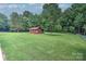 Large backyard featuring a storage shed and green grass at 4004 Stillwater Ct, York, SC 29745