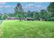 Wide shot of expansive backyard featuring various storage structures and green space at 4004 Stillwater Ct, York, SC 29745