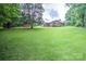 Expansive backyard featuring a home, shed, and large grassy area at 4004 Stillwater Ct, York, SC 29745