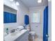 Fresh bathroom with a blue shower curtain, a white vanity, and neutral tile flooring at 4004 Stillwater Ct, York, SC 29745