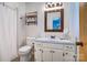 Well-lit bathroom with white cabinets, a framed mirror, and a shower featuring a white curtain at 4004 Stillwater Ct, York, SC 29745