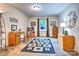 Functional bedroom features carpeted floor, a window with curtains, and an office desk for a convenient workspace at 4004 Stillwater Ct, York, SC 29745