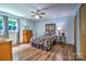 Cozy bedroom with wood floors, a floral-themed bed, and a ceiling fan offering comfort and style at 4004 Stillwater Ct, York, SC 29745