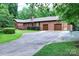 Charming brick home featuring a two-car garage and mature trees at 4004 Stillwater Ct, York, SC 29745