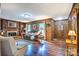 Charming living room with a brick fireplace and beautiful hardwood floors at 4004 Stillwater Ct, York, SC 29745