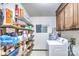 Organized storage room featuring shelving, a washing machine, and ample space for household essentials at 4004 Stillwater Ct, York, SC 29745