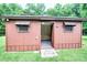Storage shed with awning windows and an open door at 4004 Stillwater Ct, York, SC 29745
