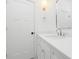 Bright bathroom with white cabinets, quartz countertop, chrome hardware and a framed mirror at 4032 Brandy Creek Ct, Clover, SC 29710