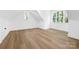 Bright bedroom with white trim, wood-look flooring, and dual windows at 4032 Brandy Creek Ct, Clover, SC 29710