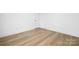 Bright bedroom with white trim, wood-look flooring, and a solid core door at 4032 Brandy Creek Ct, Clover, SC 29710