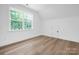 Bedroom with large window that provides natural light and hardwood flooring at 4032 Brandy Creek Ct, Clover, SC 29710