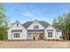 Charming two-story home with white siding, dark roof, and a well-maintained front lawn at 4032 Brandy Creek Ct, Clover, SC 29710