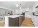 Modern kitchen featuring a large island, stainless steel appliances, and white cabinetry at 4032 Brandy Creek Ct, Clover, SC 29710
