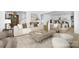 Bright living room with stylish furniture, neutral decor, and a view into the kitchen at 4032 Brandy Creek Ct, Clover, SC 29710