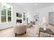 Elegant living room with a fireplace, comfortable seating, and large windows for natural light at 4032 Brandy Creek Ct, Clover, SC 29710
