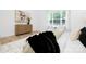 Bright and airy main bedroom with a large window and artwork at 4032 Brandy Creek Ct, Clover, SC 29710
