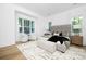 Main bedroom with large windows, a seating area, and a neutral color palette at 4032 Brandy Creek Ct, Clover, SC 29710