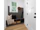 Mudroom with a built-in bench, storage cubbies, coat hooks, and white plank door at 4032 Brandy Creek Ct, Clover, SC 29710