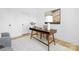 Bright office with a stylish desk, modern decor, plush chair and white walls at 4032 Brandy Creek Ct, Clover, SC 29710