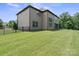 Spacious backyard with well-maintained lawn, black metal fence, and a view of the home's exterior at 426 Kirkbride Ct, Fort Mill, SC 29715