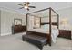 Spacious bedroom featuring a four-poster bed, neutral tones, and ample natural light creating a serene retreat at 426 Kirkbride Ct, Fort Mill, SC 29715