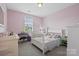 Cozy pink bedroom with a crib, window, and vanity for a  at 426 Kirkbride Ct, Fort Mill, SC 29715