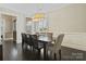 Formal dining room with large window, wainscoting and decorative chandelier lighting at 426 Kirkbride Ct, Fort Mill, SC 29715