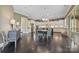 Open kitchen and dining area with island, pendant lighting, stainless appliances, and custom cabinetry at 426 Kirkbride Ct, Fort Mill, SC 29715