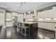 Spacious kitchen featuring a large granite island and modern stainless steel appliances at 426 Kirkbride Ct, Fort Mill, SC 29715