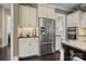 Well-equipped kitchen area with stainless steel refrigerator and ample cabinet space at 426 Kirkbride Ct, Fort Mill, SC 29715